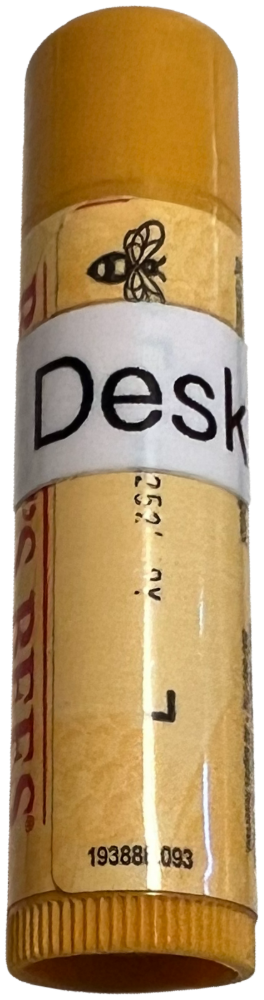 Lip balm labeled Desk